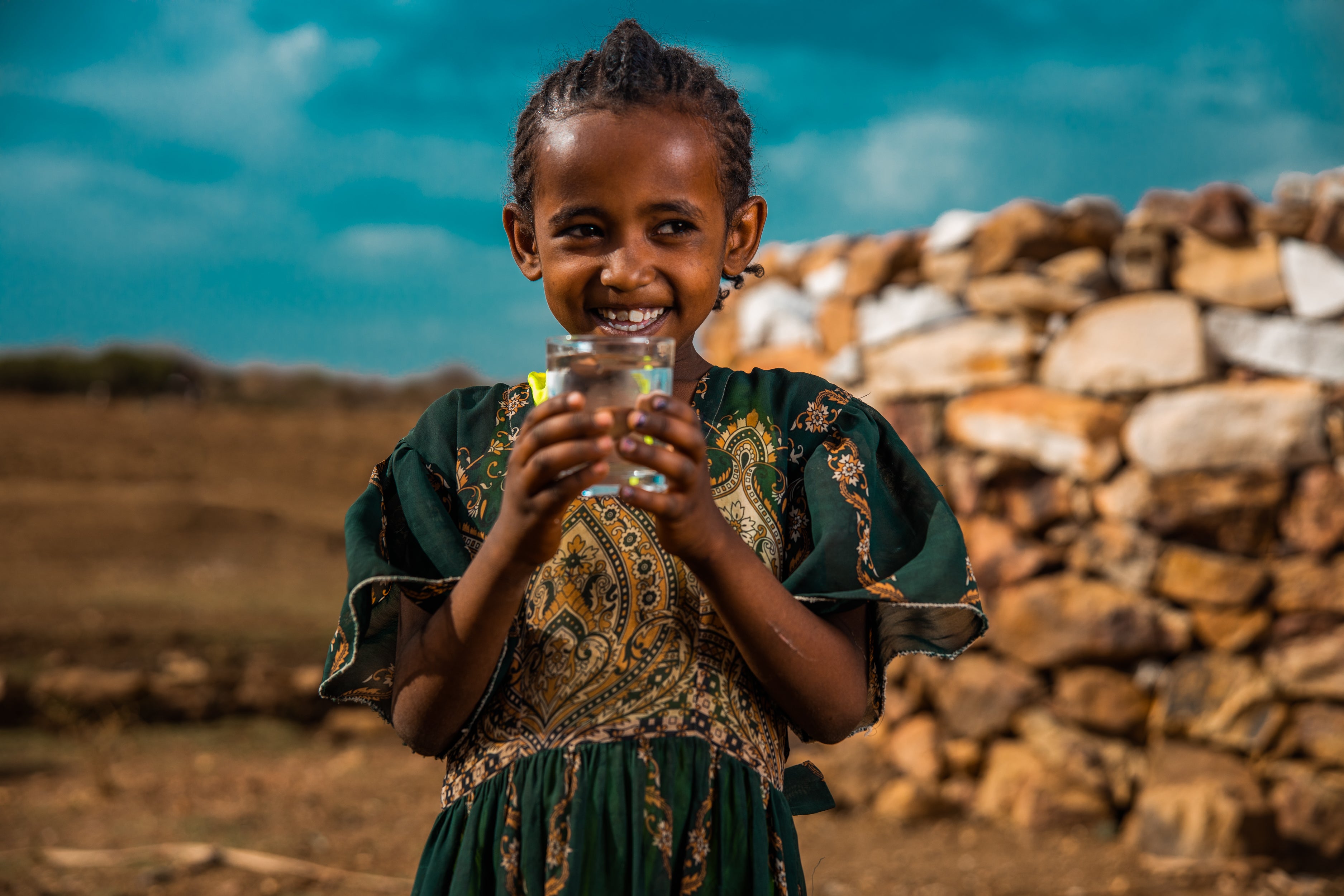 Young girl smiling with water